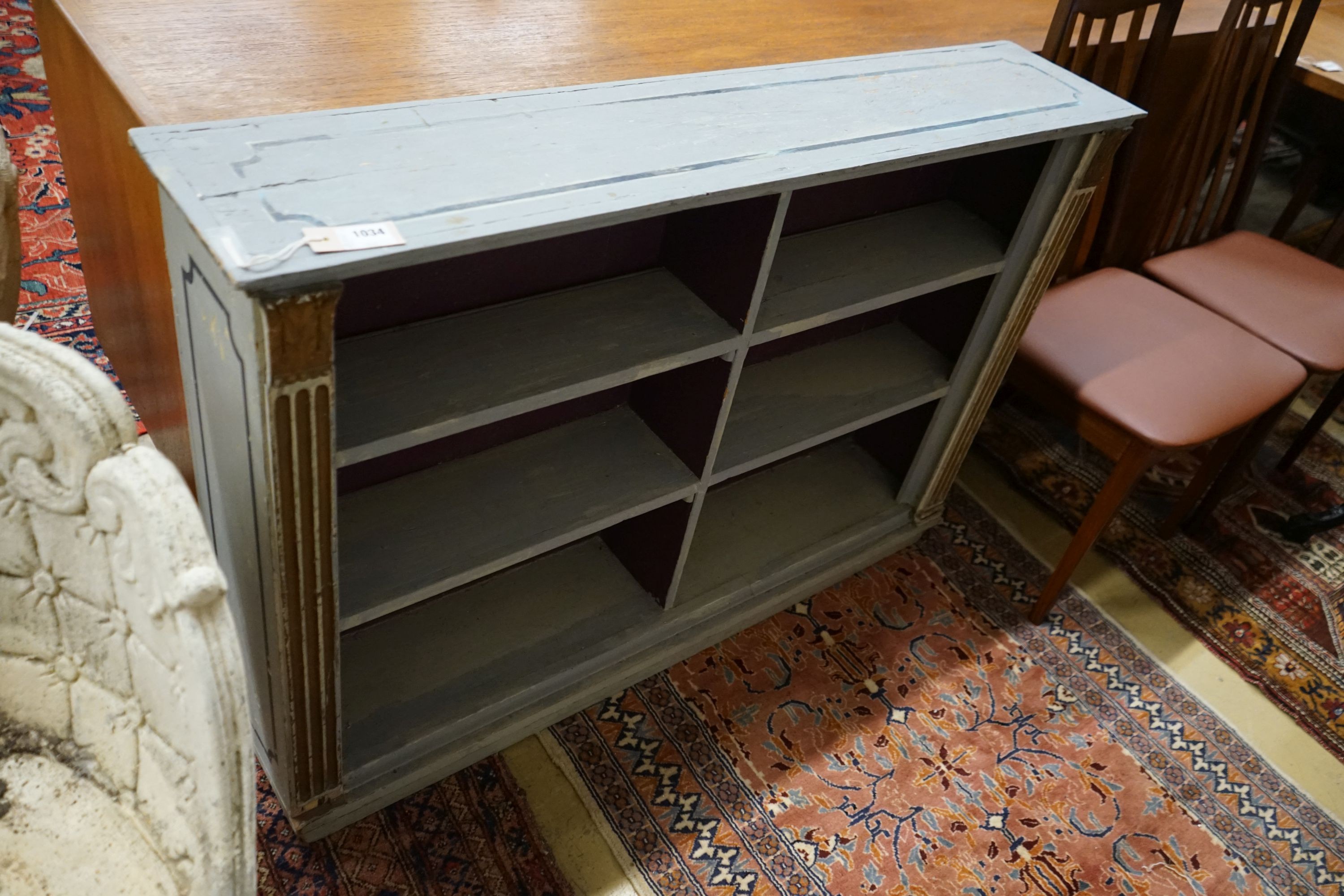 A blue painted pine open bookcase, width 120cm, depth 24cm, height 83cm